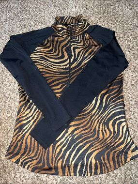 Ralph Lauren three-quarter zip black and tiger print golf shirt.